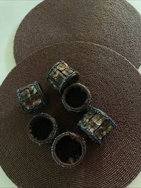 2 plate chargers and 6 napkin rings , glass beads, brown